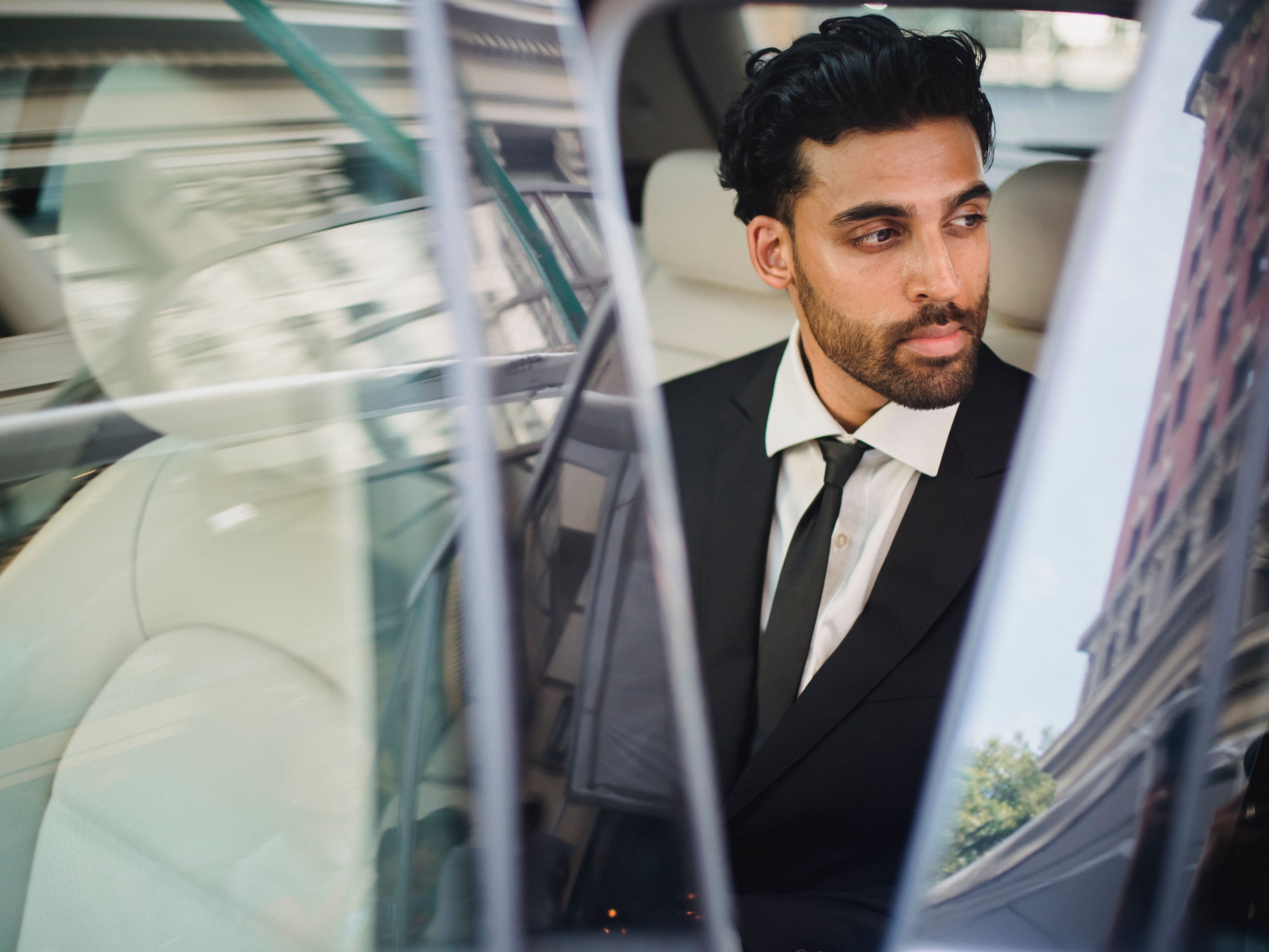 City to city chauffeur Saudi Arabia, executive riding in the rear seat of a chauffeured sedan between cities