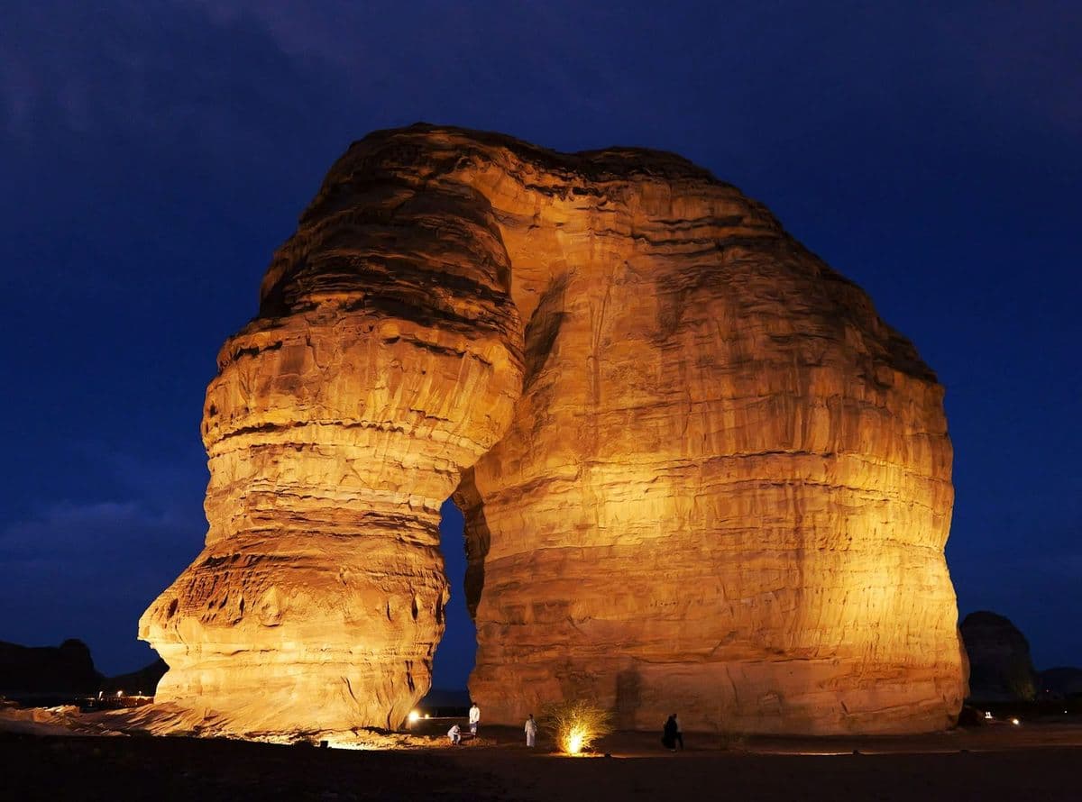 Elephant Rock at AlUla, floodlit against the night sky
