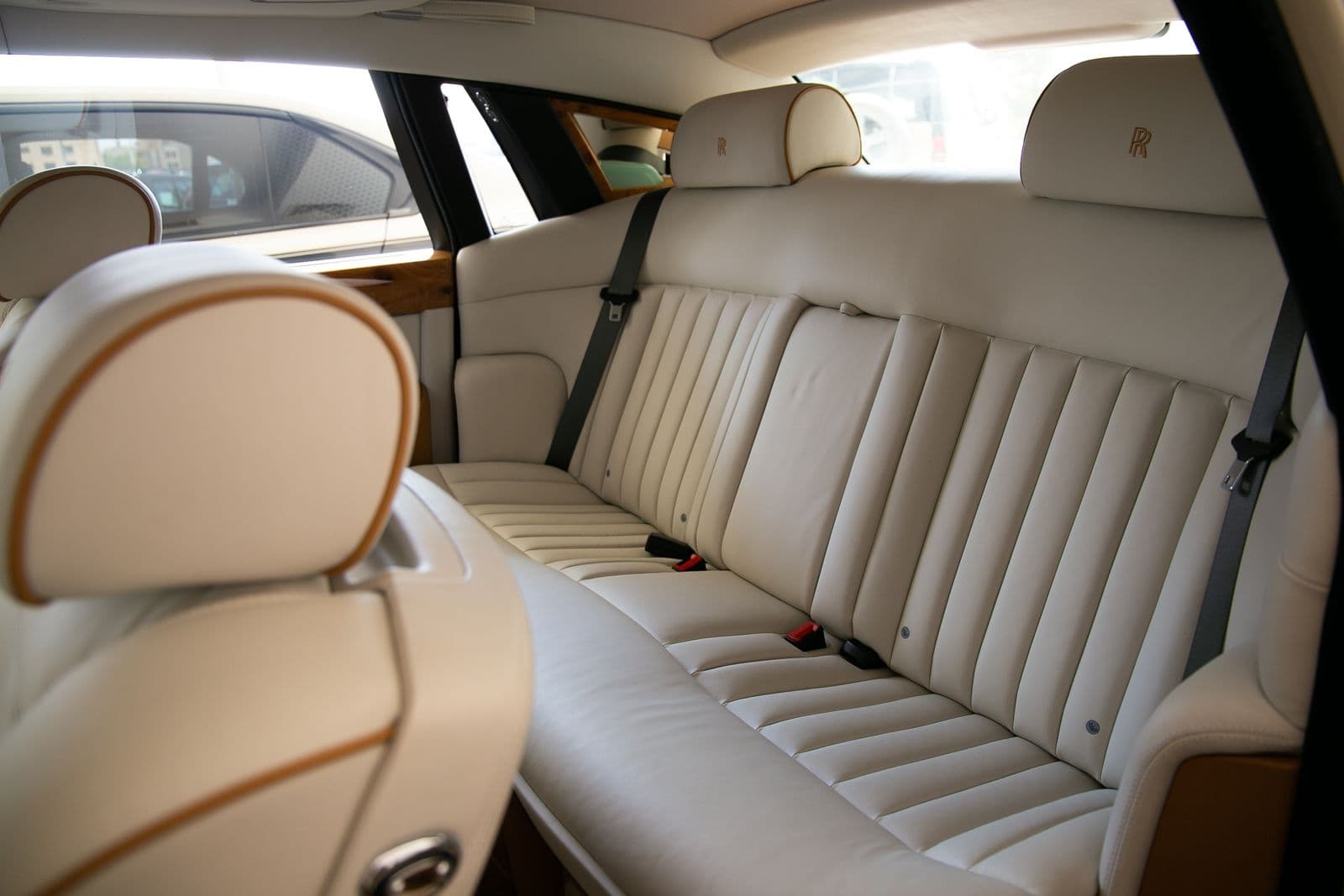 The white leather rear cabin of a Rolls-Royce, the car most Jeddah weddings ask for first