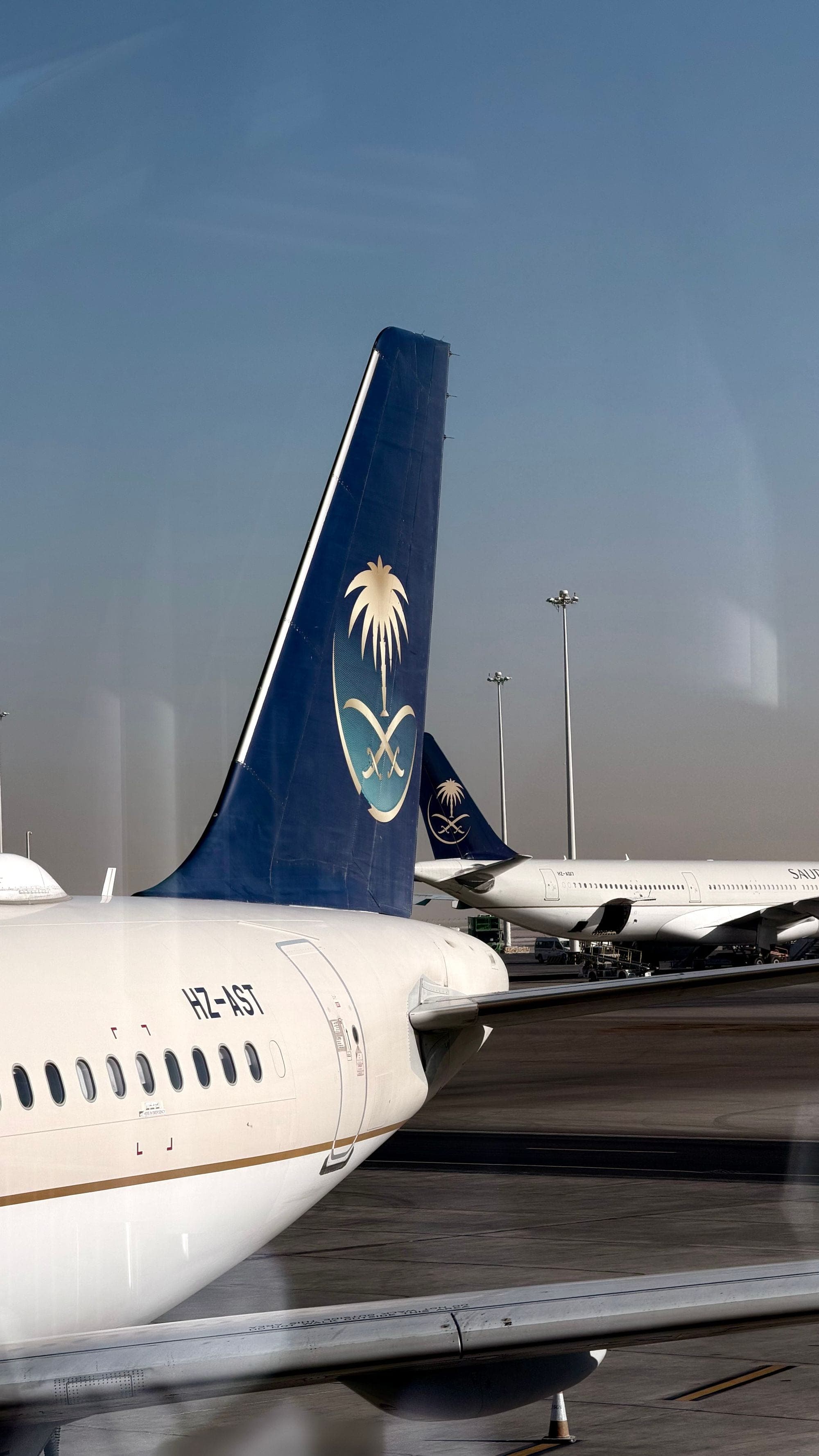 Saudia aircraft tails at the stand, the airline most Jeddah arrivals land with