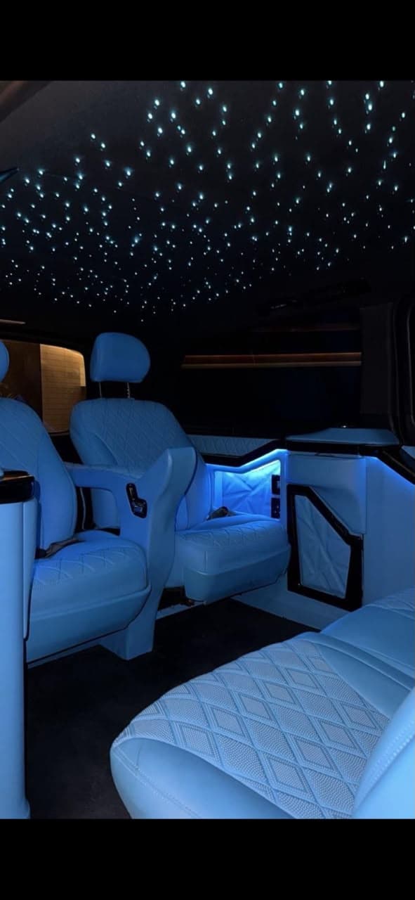Starlight headliner glowing above the VIP cabin seats