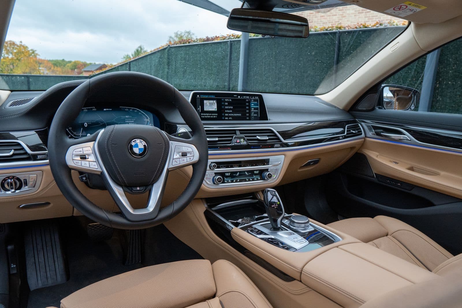 Flagship saloon cockpit, wheel and widescreen display over cognac leather