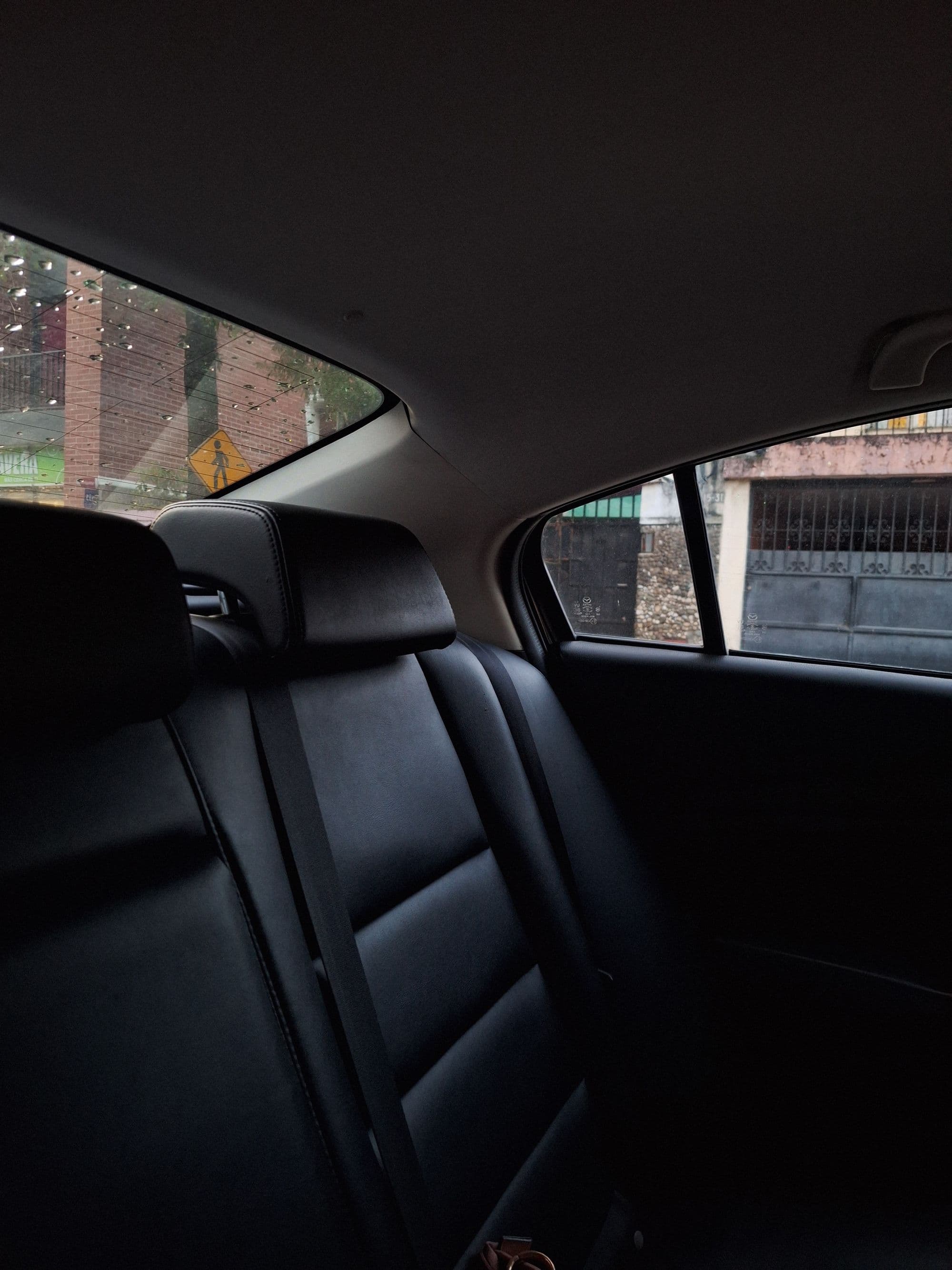Rear cabin in black, seats and trim in low light