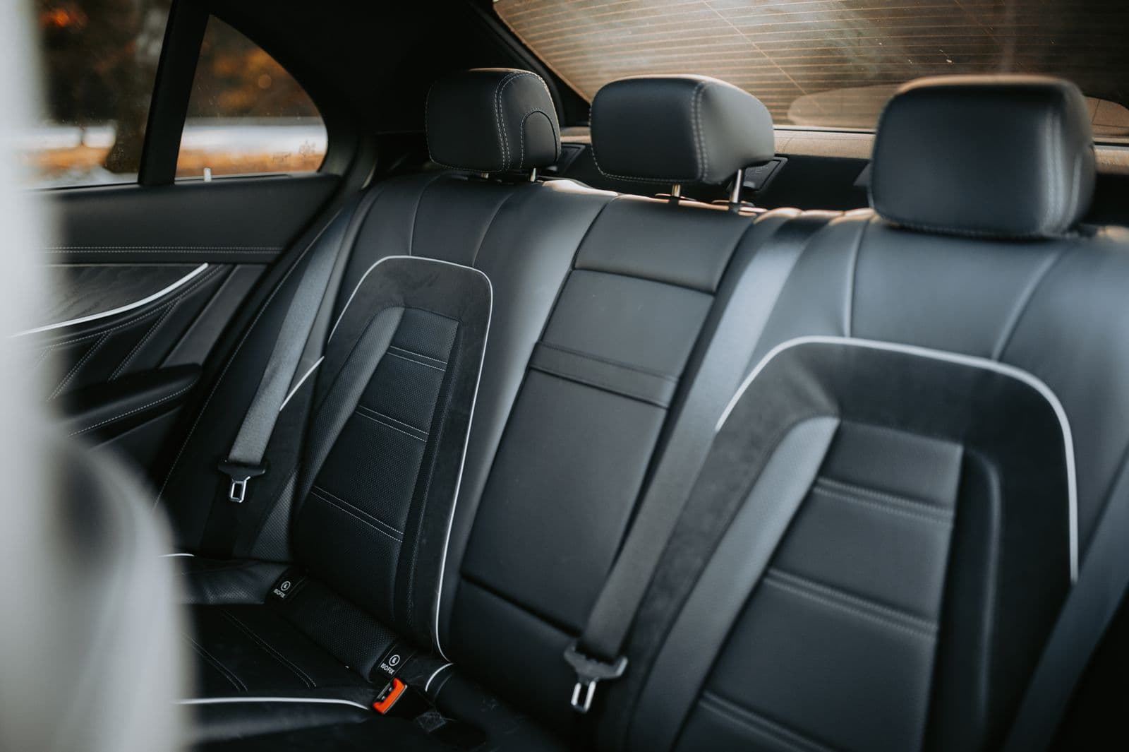 Black leather rear seats with contrast stitching, the seats the guest rides in