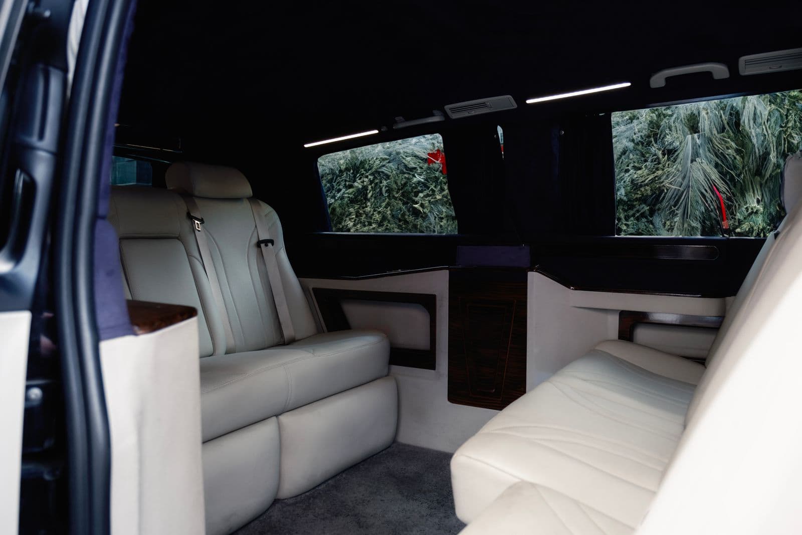 Executive van cabin with facing seats in cream hide
