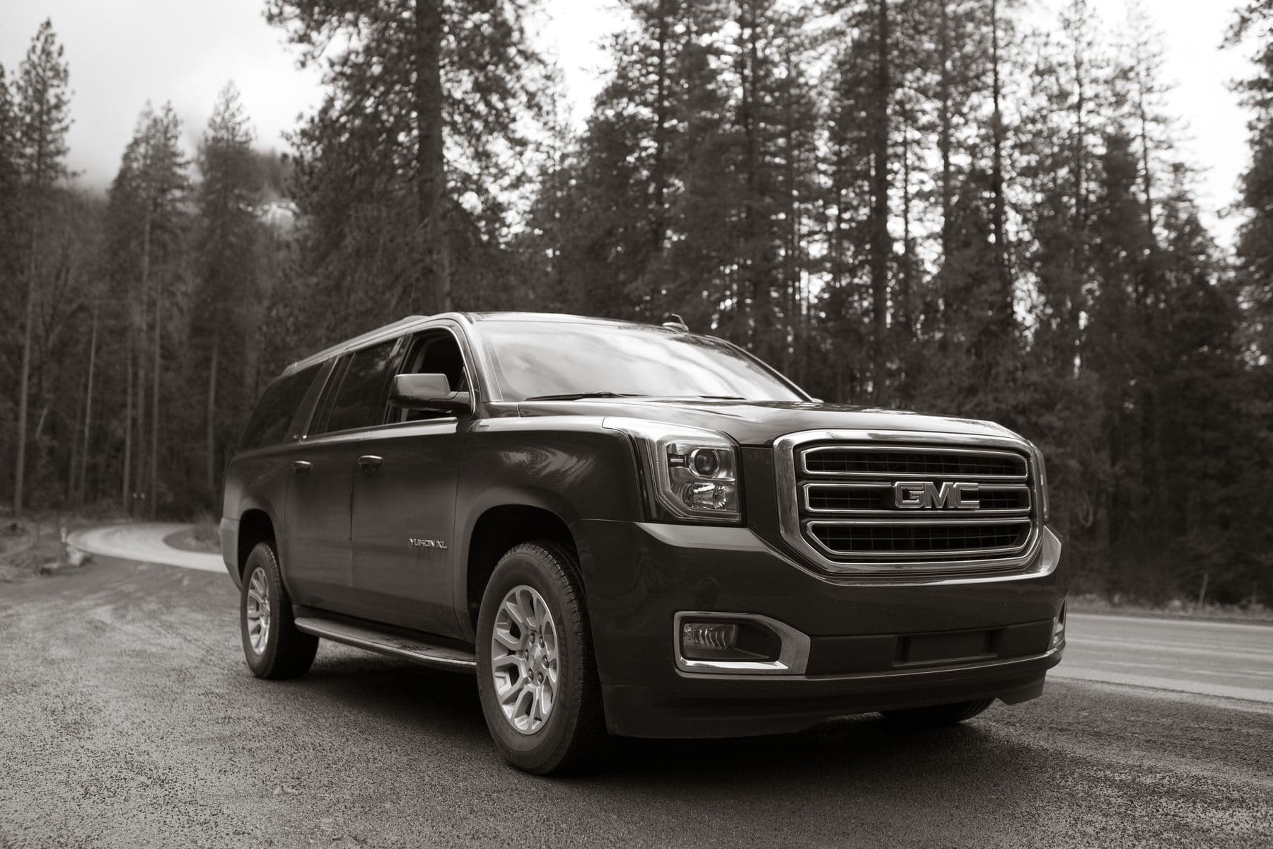 A GMC Yukon XL on an open road