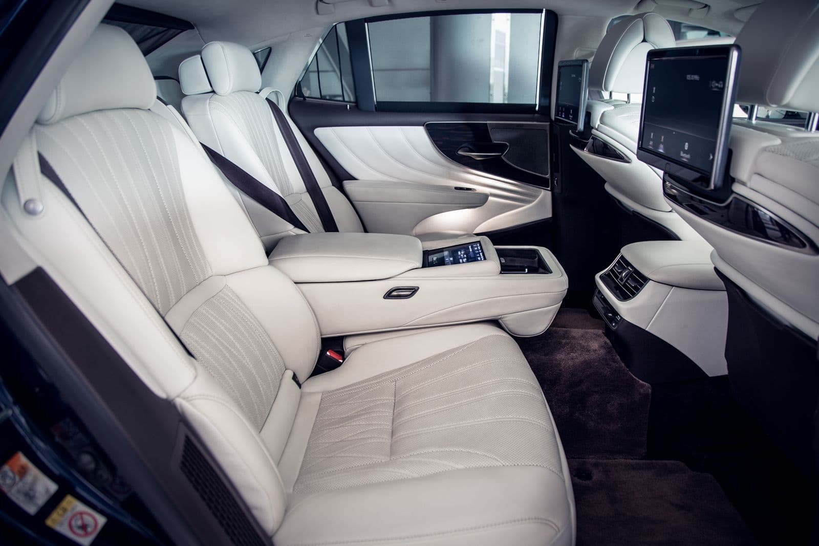 Rear lounge with entertainment screens behind both front headrests
