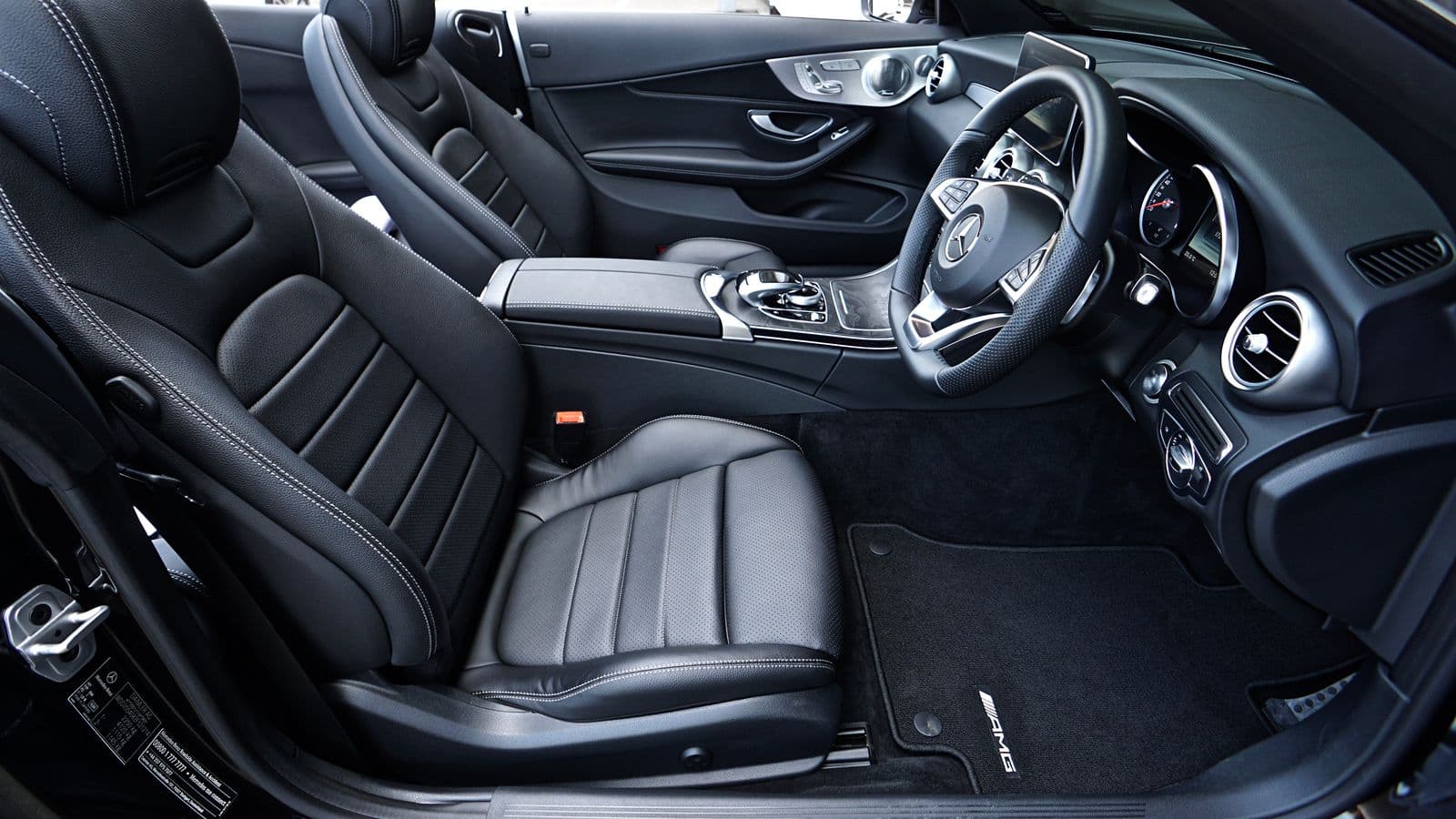 Mercedes-Benz cabin in black leather with brushed metal trim