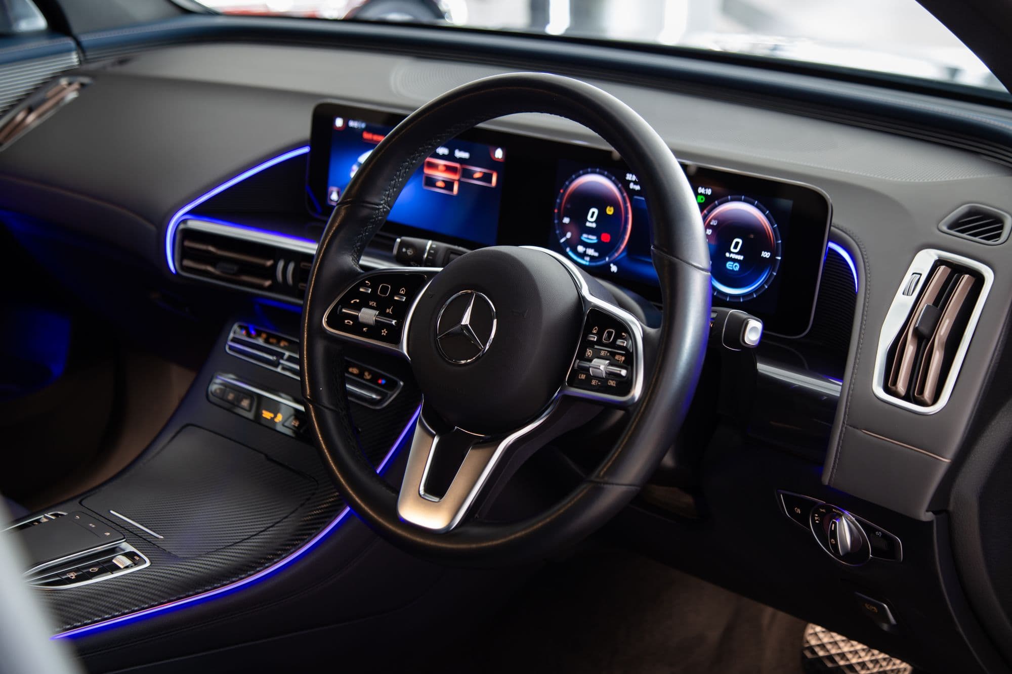 Mercedes-Benz black cockpit under blue ambient light piping